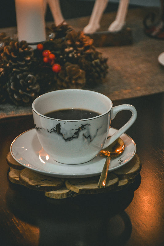 a cup of coffee sitting on top of a saucer
