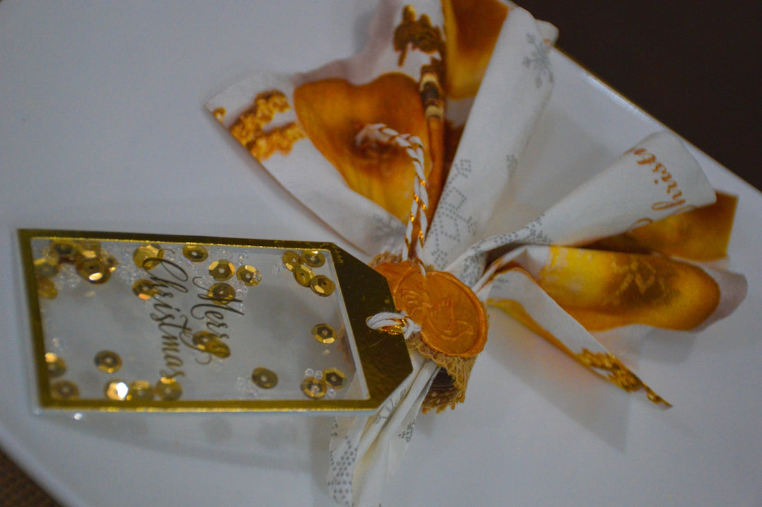 a white plate topped with gold and white candy