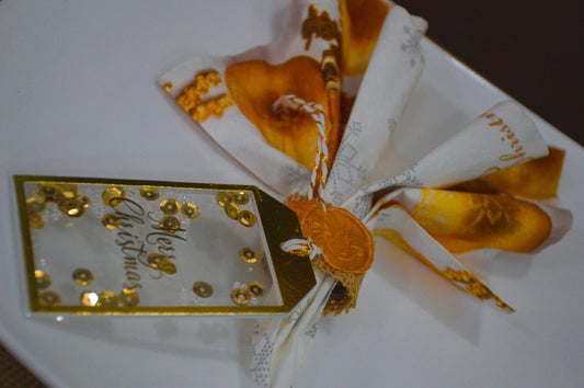 a white plate topped with gold and white candy