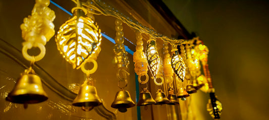 A bunch of bells hanging from a building