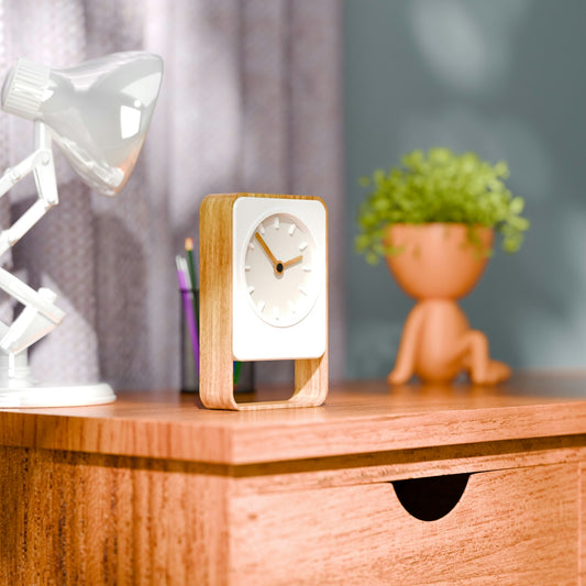Desk with lamp, clock, and plant