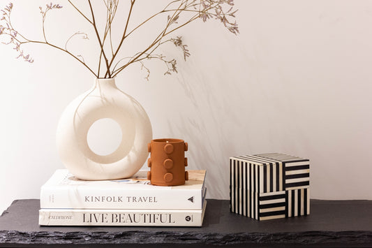 Decorative objects on a shelf with books